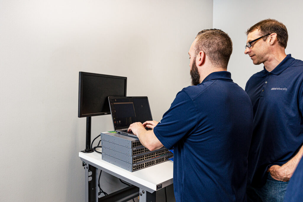 Two engineers performing a Microsoft 365 migration